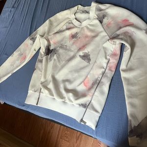 Multi colored sweatshirt wit two zippers in front from Zara.